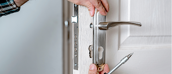 Installation of a residential door handle with locks.